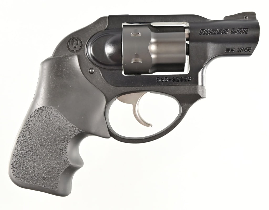 Ruger LCR-22MAG .22 WMRF Revolver: S/N 548-62625. In original factory box. 2" barrel. Two Magazines. Modern.