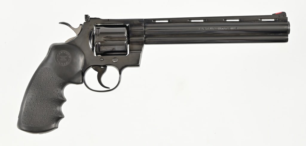 Colt Python .357 Magnum Revolver: 8" barrel serial no. K49172. Original issue Python, nice condition. Hogue grips. Modern.
