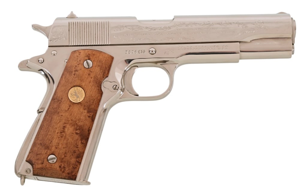 Colt 1911 World War II Commemorative .45 Auto: S/N 7875ET0. European African Middle Eastern Theater Dec. 11, 1941 -- May 7, 1945. 5/1/2" barrel. In wood case 12/12 x 10 x 4 1/2. Modern.