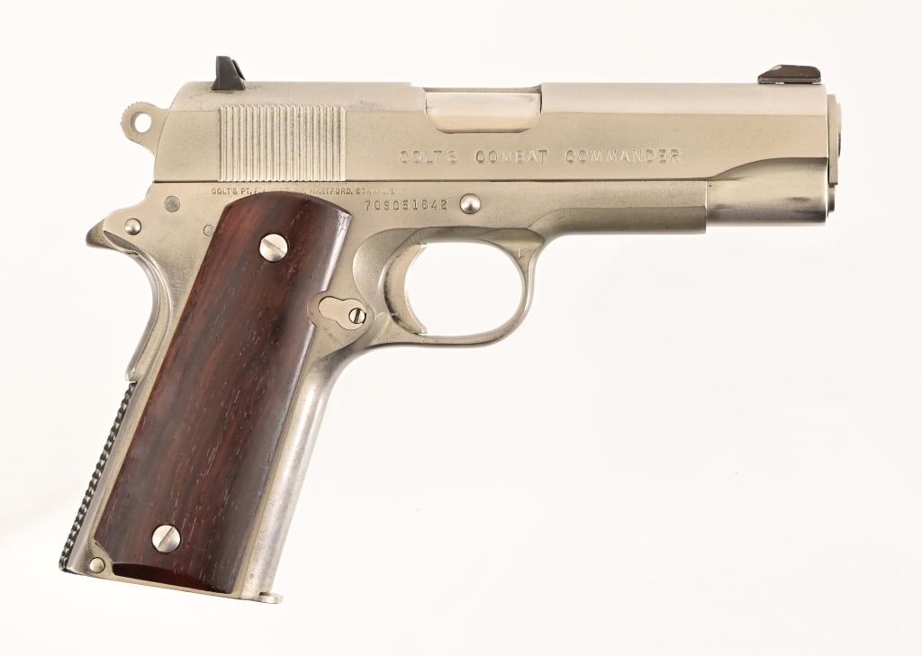 Colt Combat Commander 1911 Semi-Auto .45ACP: 4.25" barrel, good bore. Stainless in good condition. S/N 70SC51642. Modern.