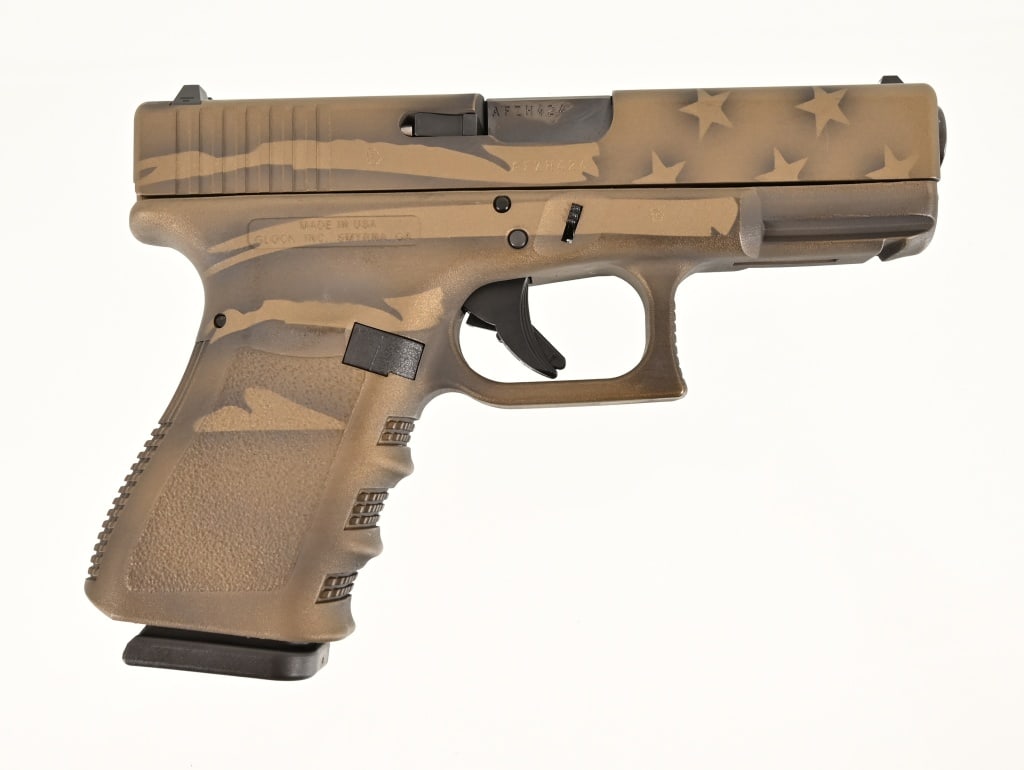 Custom Glock 23 Bronze American .40 Pistol: S/N AFZH424. In original factory case. 4" barrel. Two Magazines. Modern