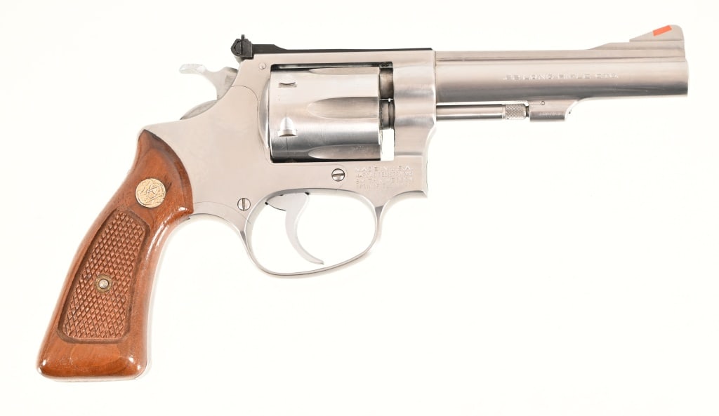 S&W Model 63 .22LR Revolver: 4" barrel, stainless steel finish, wood grips, In original factory box. S/N M207591. Modern.
