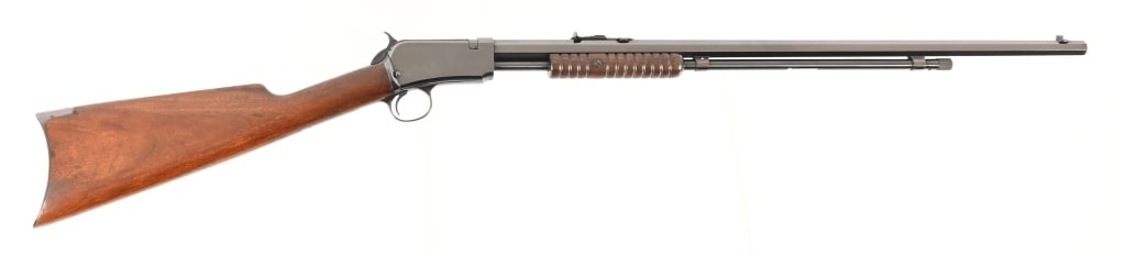 Winchester model 1890 Pump Action Rifle .22 W.R.F.: 24" Barrel, S/N 588391. Has been re-blued and wood refinished at some point. Modern