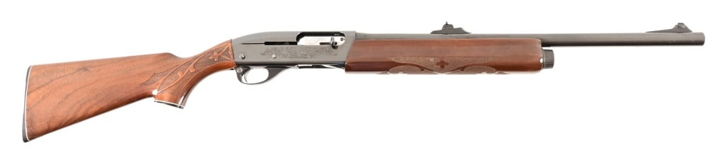 Remington 1100 12GA Slug Shotgun: SN N041186V. 21" smooth bore barrel with rifle type sights. Extra long receiver screws installed which would support a scope mount. Modern.