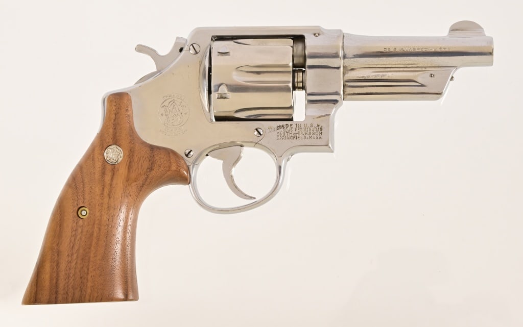Smith & Wesson .38 Special Revolver: SN 7825. 4" barrel, good bore. Solid action. Likely re-nickleled at some point. S&W grips are a modern replacement. Modern.