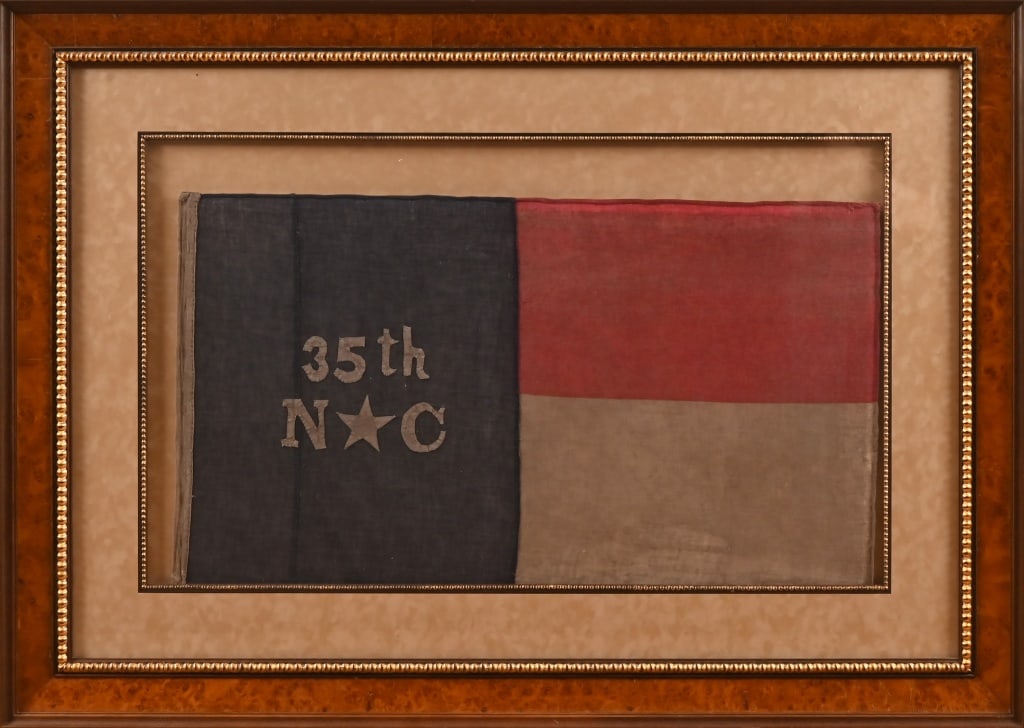 Confederate Civil War 35th NC Regiment Flag: Framed, behind glass. Flag measures 36" x 20 1/2". Frame measures 52 1/4" x 37 1/4". Well made modern reproduction