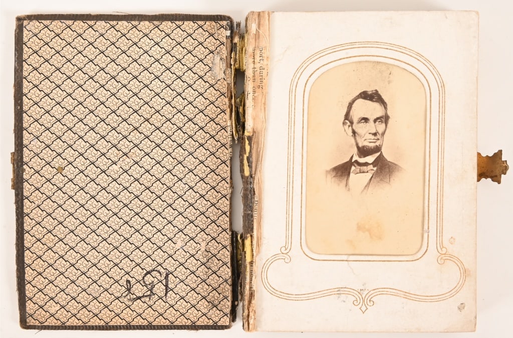 Antique Civil War Military Photo Album Abe Lincoln: Abraham Lincoln on first page. Album measures 4" x 5 1/2". Images measure 2" x 3 1/4".