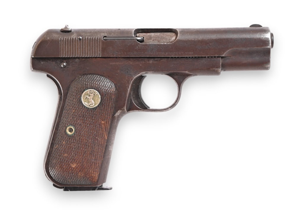 Colt 1903 .32 ACP: 3.75" barrel, bore is fair. Made in 1912. Working action, finish is gray patina. Colt medallions on grips. Magazine is not original. Modern.