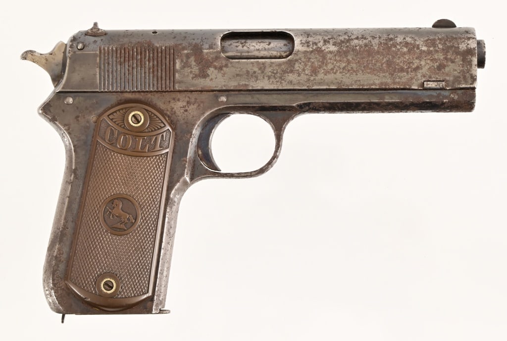 Colt M1902 .38ACP Pistol: SN 30762. 4.25" barrel, bore is dark but with defined rifling.. Made in 1909. Rather extensive exterior rust. Action works and grips are solid. Modern.