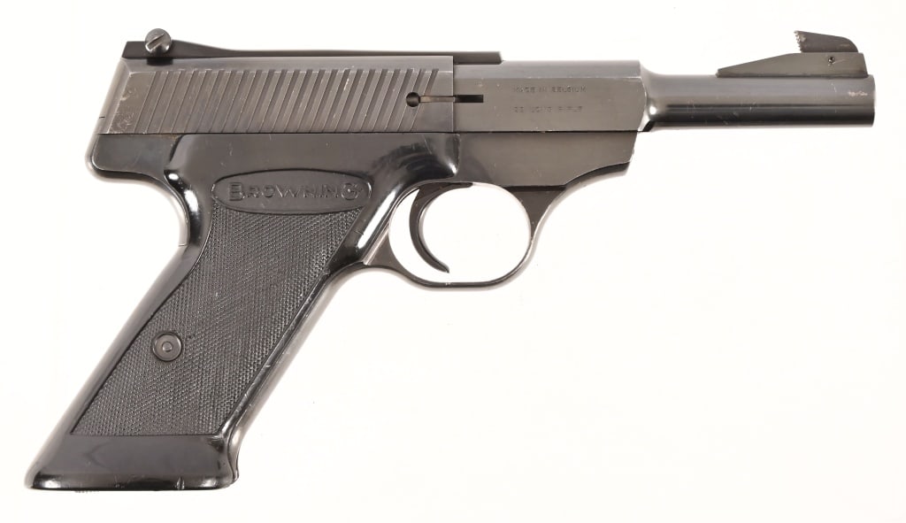 Browning Belgium Nomad .22LR Pistol: S/N 18845P69. Blued finish, 4.5" barrel, original Browning grips. Comes with a leather holster. Modern