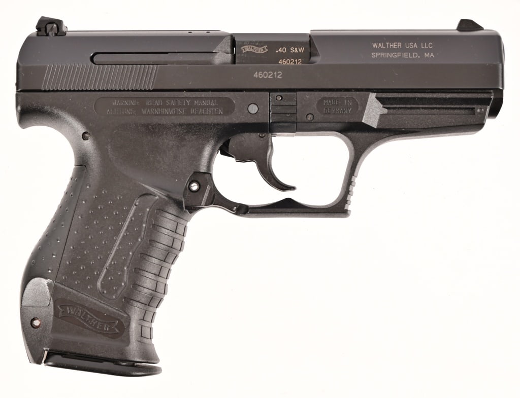 Walther P99 Semi-Auto .40 Pistol: S/N 460212. As new in factory box with papers. 4" barrel. 2 - 12 rd. mags, 1 - 10 rd. mag. Modern.