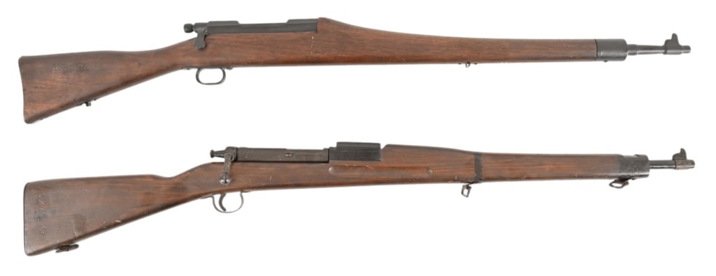 2 Wood Training Rifles: Wood trainer of 1903 US military rifle. Marked 26 on stock. Non-firing. Wood copy of 1903 military rifle, used for training and drills.