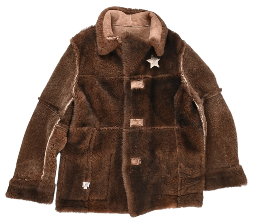 Yellowstone 1923 Men's Coat & Special Ranger Badge: Coat with Montana Livestock Assoc. Special Ranger badge used during the filming of Yellowstone 1923. Appears to be reversible. No discernable size.