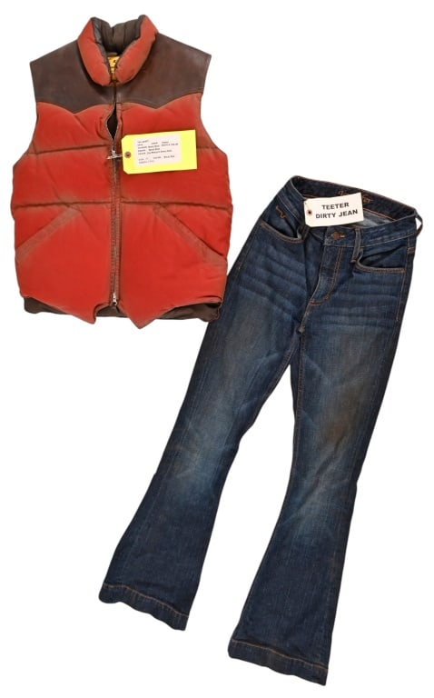 Yellowstone Teeter Screen Worn Jeans & Vest: Teeter's dirty jeans size 000/32 and Western Burnt Red Down vest size M. Teeter is a fierce, tough-talking ranch hand with signature pink hair played by Jennifer Landon on the hit TV series Yellowston