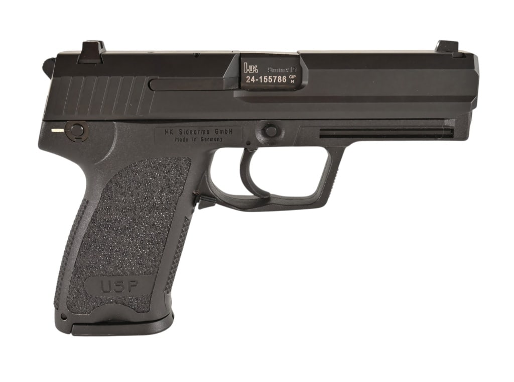 HK USP .9mm Pistol: 4" barrel, extra magazine, with original factory hard case. Like new condition. SN: 24-155786.