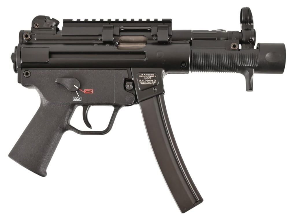 HK SP5 K .9mm Pistol: Unfired condition, 5 1/4" barrel, adjustment tool, sling, and extra magazine, with original factory hard case. Like new condition. SN 215-002238. Modern.