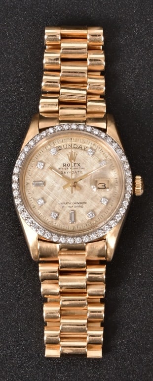 Rolex Oyster Perpetual Diamond Bezel Gold Watch: Men's gold watch, working condition, diamonds on bezel and on face. With box and appraisal. "One men's Rolex, Oyster Perpetual Day-Date wrist watch. The watch features a 36.0mm case with an 18kt.