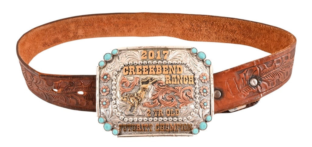 Yellowstone Kids Prop Buckle And Belt: From the popular TV Series Yellowstone. Creekbend Ranch 2017 2 Yr Old Futurity Champion, measures 4 1/2" x 3 1/2". Unmarked belt, measures 28 1/2" long.