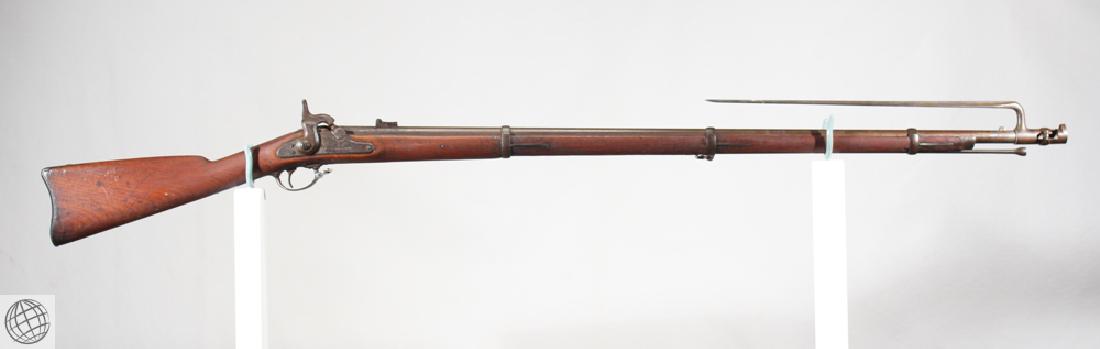 Model 1861 SPRINGFIELD PERCUSSION RIFLED MUSKET 40" Bbl: Details: This Springfield Model 1861 percussion rifled musket with bayonet is dated 1864. The barrel measures approx. 40" and .58 cal.. Please attend our live sale to inspect this and many other rare 