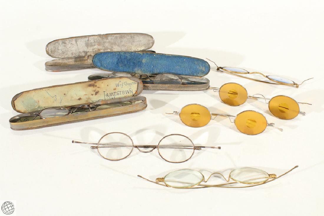 10Pcs Civil War Era ANTIQUE EYEGLASSES AND CASES: Details: 10Pcs. Seven pairs of antique Civil War Era sliding temple eyeglasses, and three period eyeglass cases made of tin. This lot consists of: two pairs of silver-colored frame period sliding tem