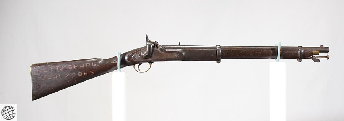Enfield Model 1853 Style CARBINE GUN Gettysburg Stock: Details: This carbine in the style of an Enfield Model 1853 features a "Gettysburg" carving to stock, a partial crown on the lock, a smooth bore, and sling swivel. Please attend our live sale to inspe