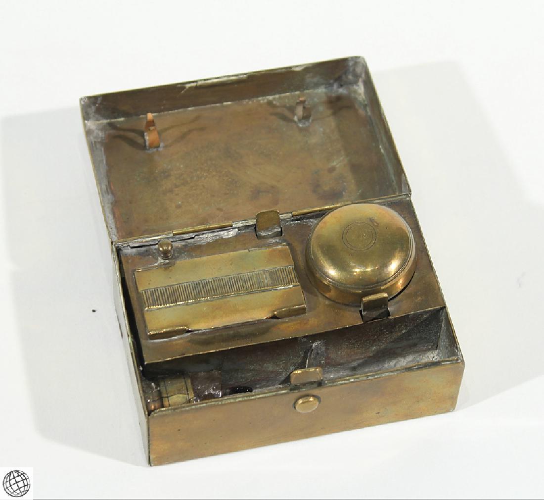 Antique Travel Writing Kit SEALING WAX MATCHES CANDLE: Details: This lot consists of an antique travel writing kit in a small brass or metal box. When open the box reveals a bit of candle in a holder and space for a seal, a small rounded lid that covers