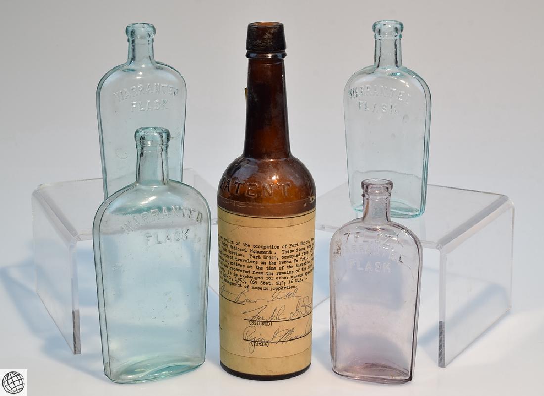 5Pcs Civil War Era 19th Century ANTIQUE GLASS FLASKS: Details: 5 Pcs. Antique Civil War Era Glass Bottle and glass Warranted flasks. The brown glass Patent ale bottle is a dug relic from Fort Union, New Mexico. Measures 11" tall. Has label taped around b
