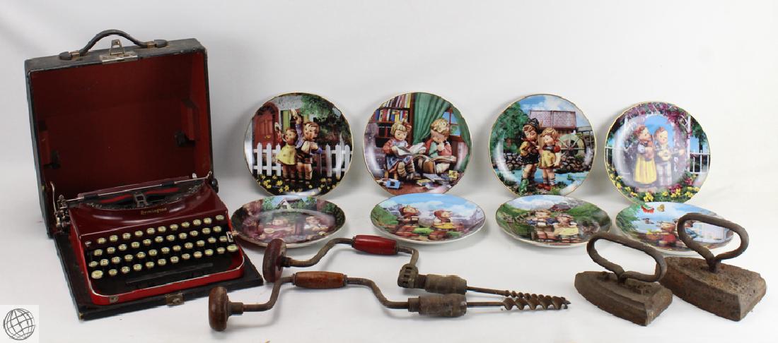 13Pcs Vintage And Antique ESTATE COLLECTIBLES Sad Irons: Details: This lot comprises vintage and antique estate collectibles, including eight Hummel collectors plates; two antique sad irons; two hand-drills; and a vintage portable Remington typewriter. The