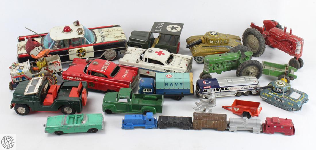 Large Collection ANTIQUE AND VINTAGE STAMPED METAL TOYS: Details: This lot comprises a collection of antique and vintage stamped tin or steel toys. Contains approximately 20 individual toys, such as: firetruck; tractor, Army tank; Army Jeep, cars, Highway