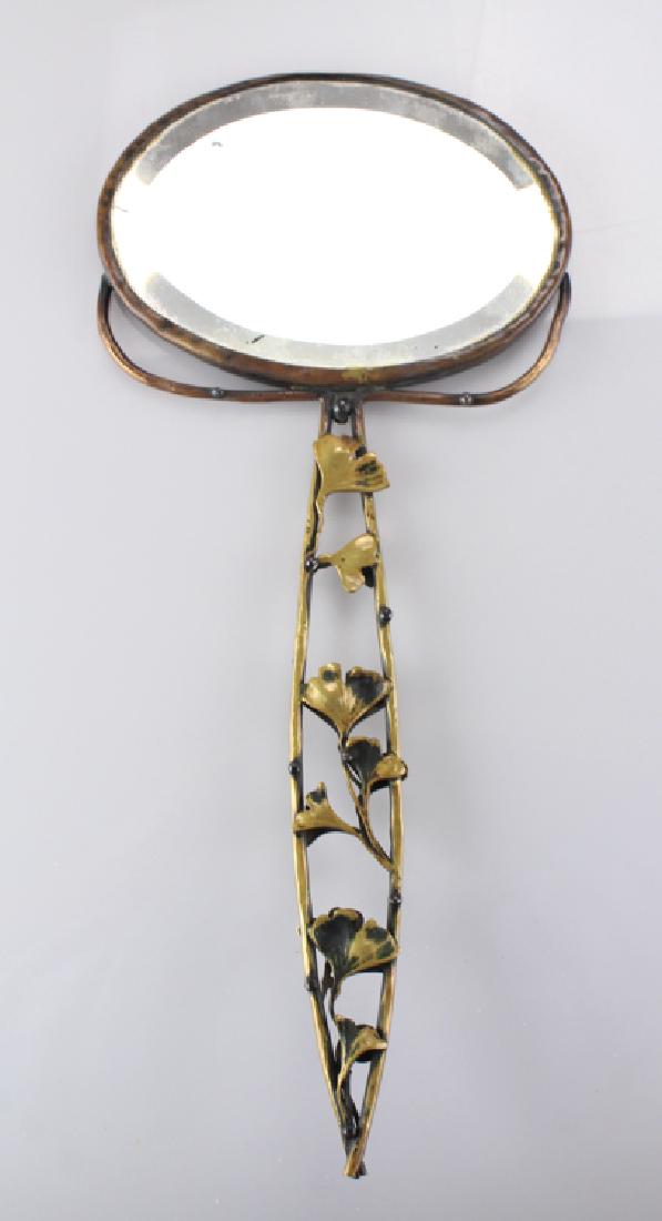 Art Nouveau Style ANTIQUE HAND MIRROR WITH GILDED GINKO: Details: This lot is comprised of an antique gilded hand mirror with a ginko leaf motif. It is roughly 14" long and 6" wide at its widest point. Condition / Notes: This lot shows well with moderate