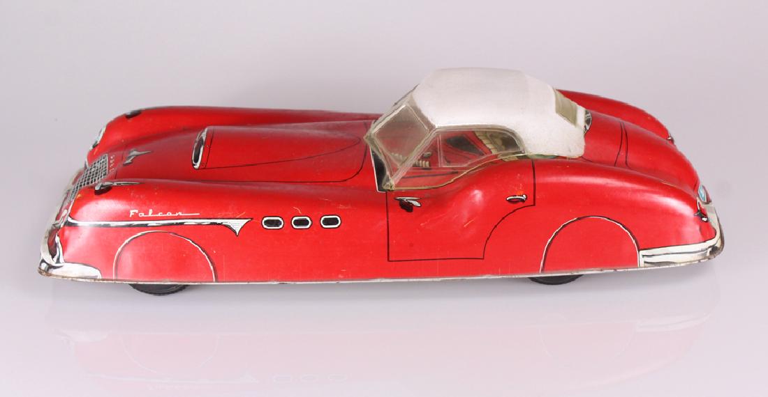 C 1955 Vintage MARX TOYS FALCON SPORTS CAR FRICTION: Details: This lot consists of a c.1955 Marx Toys Falcon color lithographed tin over-sized toy sports car with a friction drive. It measures 20" long and 8.5" wide. Condition / Notes: This lot shows