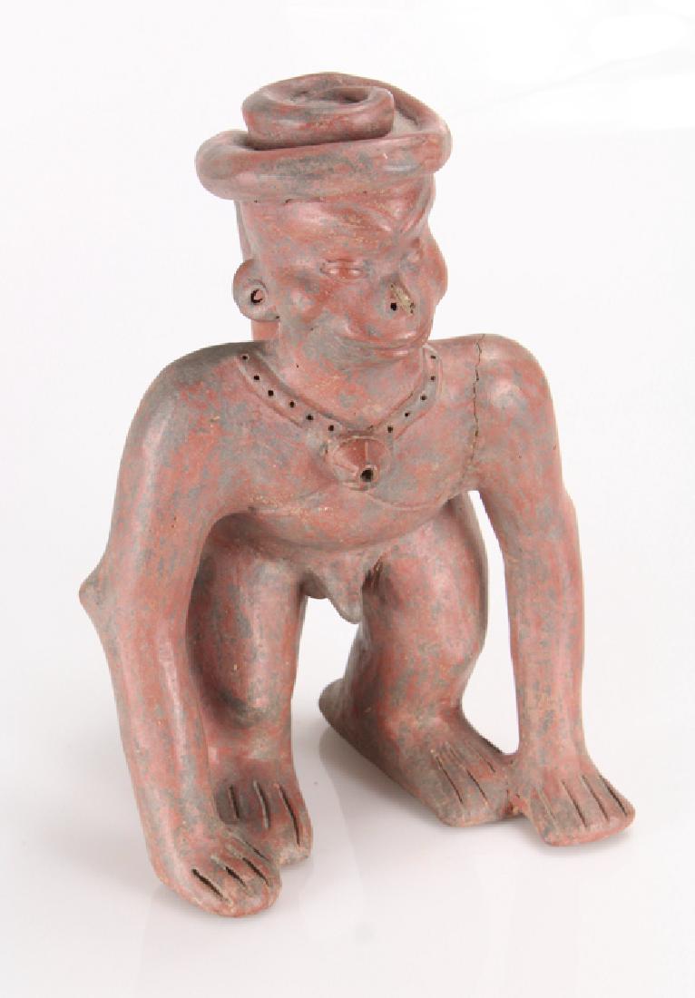 Colima Mexico ANTHROPOMORPHIC MONKEY POTTERY FIGURE: Details: This large antique anthropomorphic monkey pottery figure hails from Colima, Mexico. It shows humanoid features and a prehensile tail wrapped around his head. It stands approx. 11" tall. Colim