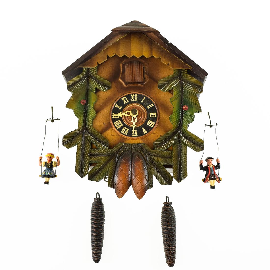 Black Forest Clock VINTAGE CUCKOO CLOCK WITH UNIQUE: Details: Black Forest Clock VINTAGE CUCKOO CLOCK WITH UNIQUE CERAMIC FIGURE PENDULUM PAIR c1965 German Collectible Decorative Original Wall Clock Maker: UnknownHistory of Maker: N/ACountry of Origi