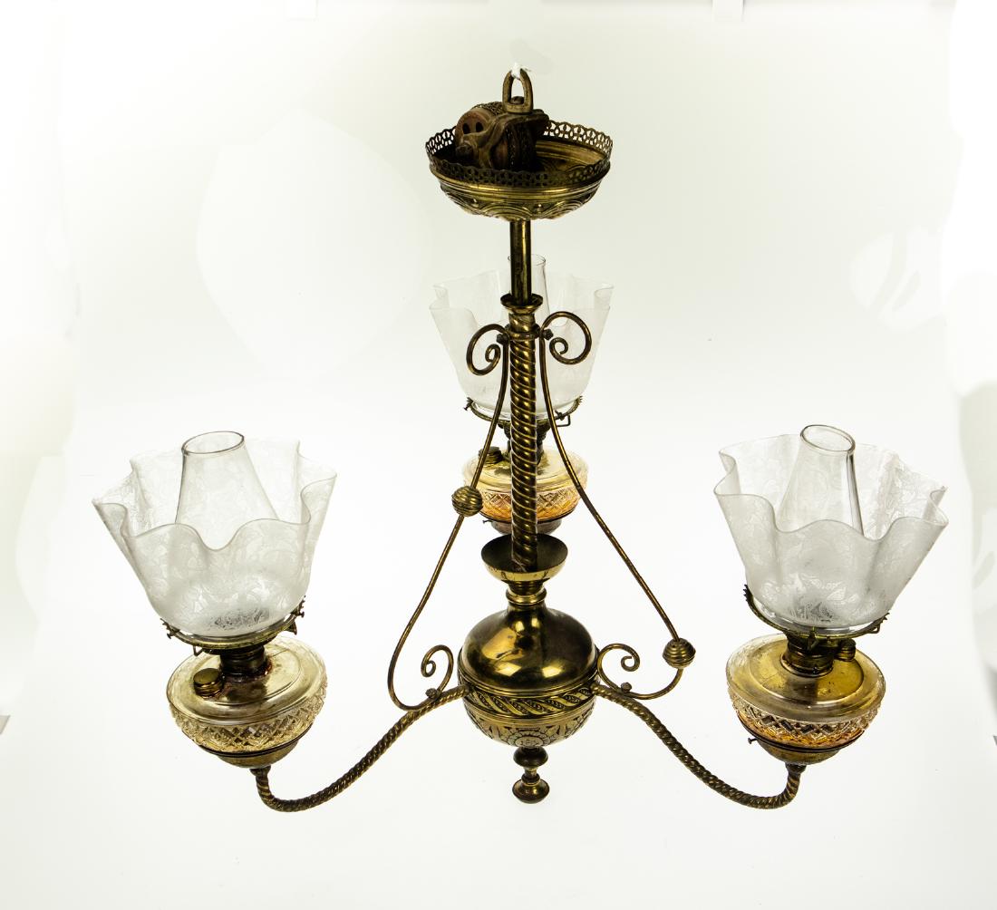 Elegant Victorian ANTIQUE OIL-BURNING CHANDELIER Estate: Details: This is a antique, oil-burning chandelier from a local estate.This elegant Victorian piece has removable lamps with decoratively sculpted glass bases. Each is fitted with Holmes, Booth & Hay
