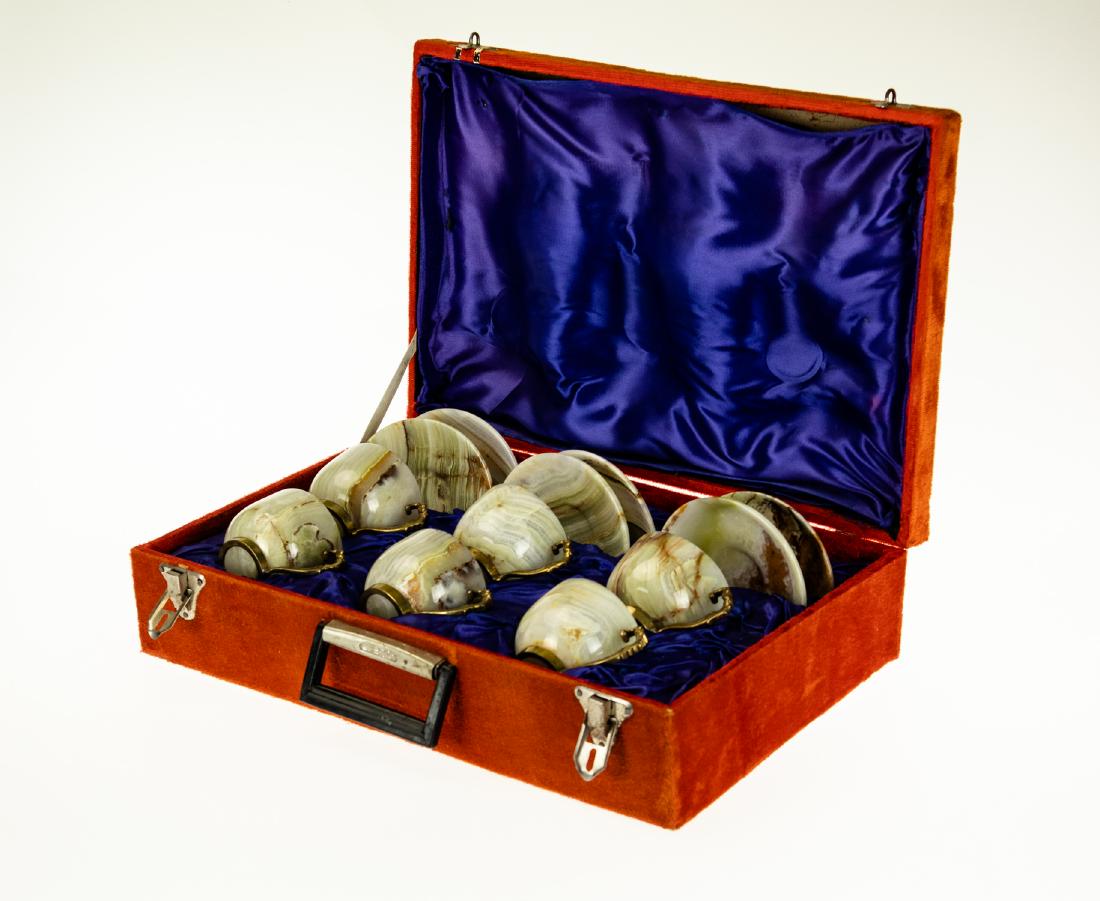 Vintage Antique WHITE ONYX AND BRASS TEA SET IN CUSTOM: Details: This lot is an impressive white onyx marble and brass tea set as shown in the corresponding images.Each piece in this vintage or antique set of six cups and six saucers is carved from a sing