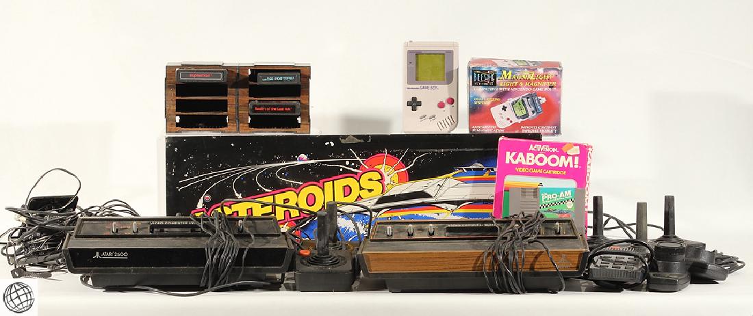 25Pcs Atari Nintendo Gameboy Activision VINTAGE GAMING: Details: This lot comprises an original Asteroids arcade game light panel and approx 25 cartridges, consoles, and accessories for a variety of vintage gaming platforms including Atari, Nintendo Gamebo