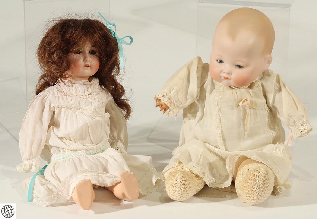 2Pcs William Goebel VINTAGE & ANTIQUE BISQUE DOLLS: Details: This lot consists of the vintage and antique dolls shown in the corresponding images. One of these dolls was manufactured by William Goebel, and the other by Kiddiejoy. Both are wearing lace-