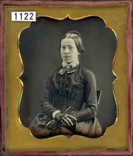 12 DAGUERREOTYPES & 2 AMBROTYPES INC. 2 HALF PLATES: #s 1 - 12 are daguerreotypes. There are 2 half plates, 1 quarter plate, and 9 sixth plates. #s 13 and 14 are ambrotypes. There is 1 quarter plate and 1 sixth plate.1) Eye popping lady with stylish