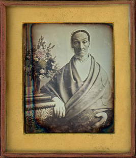 EARLY 1840s LADY RELIGIOUS ATTIRE & PLANT DAGUERREOTYPE: Quarter plate daguerreotype.From the early years, here is a bright portrait of an older woman, wearing traditional attire, next to a plant. The hand cut gold foil mat is indicative of the early