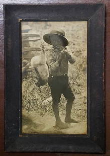 BLACK YOUTH, FEMALE PHOTOGRAPHER KATHERINE E. McCLELLAN: Signed at lower left corner: "Katherine E. McClellan." This is from pioneering female photographer, Katherine Elizabeth McClellan's Florida series. Frame is approximately 21⅝ by 14⅝