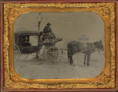 AFRICAN AMERICAN DRIVER BY STREETLAMP TINTYPE: Quarter plate tintype.Shows a black man driving a horse and buggy with his white male passenger inside. The streetlight and the buildings in the distance add a different perspective. Split case.NO