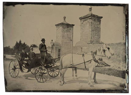 BLACK DRIVER WHITE PASSENGERS & ST. AUGUSTINE GATES TIN: Tintype.The place is the Gates of St. Augustine, Florida, the original walled city of North America. Here is an African American driver and his two Caucasian riders, preceded by two white horses.