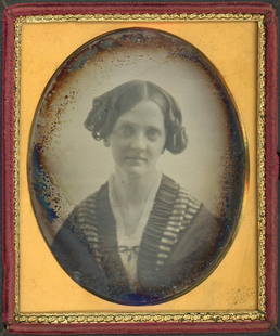 DAGUERREOTYPE OF A LADY BY SOUTHWORTH & HAWES: Sixth plate daguerreotytpe.The woman has the classic soft-focus, ambient lighting, and mid-tones that the esteemed firm is known for. Black push-button case, a silvered back, and convex glass.This