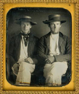 [Daguerreotype] Summer Friends: Anonymous, sixth-plate daguerreotype housed in a thermoplastic wall frame. A fine, casually-posed image of two friends, each sporting a straw boater and summer whites. What may be a pen nib is