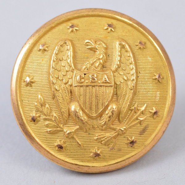 Non-Excvtd. Confederate Army Officer 26mm Button: The face has a drooped wing Eagle with the letters "CSA" on the shield and on a lined field. The button face has 100% bright gold gilt and the reverse is backmarked "S.Buckley & Co./ Birmingham". The 