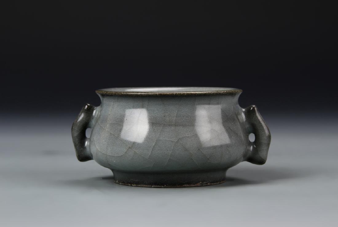 Chinese Lung Quan Yao Censer: China, antique Lung Quan Yao censer, on a slightly raised base, with an arched, rectangular handle on each side, in a grey glaze with a high shine surface. Width 4 in., Height 1 7/8 in.