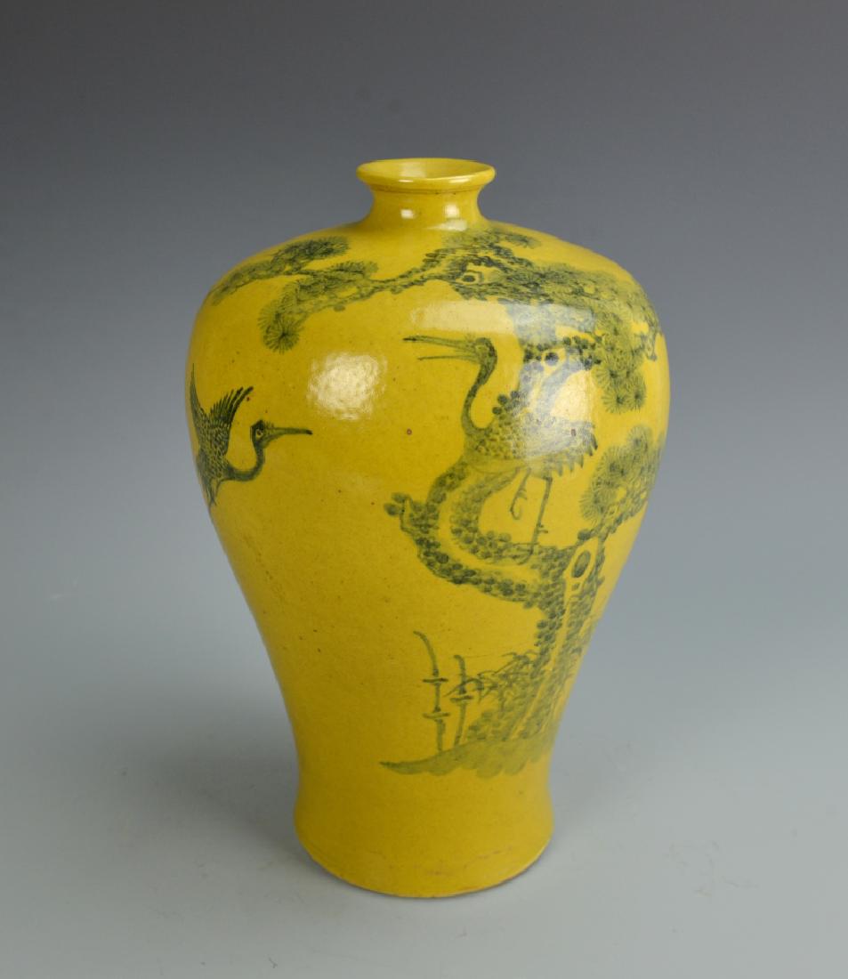 Chinese Antique Yellow Glazed Meiping Vase: China, antique yellow glazed Meiping vase, with a narrow, slender body with high rounded shoulders, glazed with a smooth, high shine surface, with blue paintings of a crane and pine tree. Height 10 3/