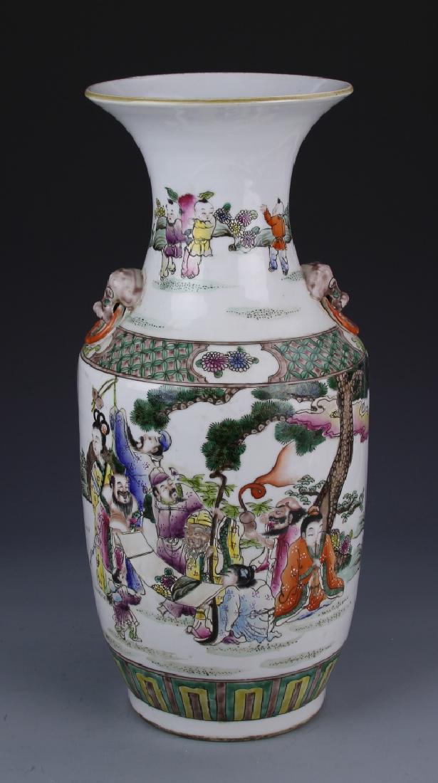 Chinese Famille Rose Vase: China, Famille Rose vase, baluster form with footed base and elongated neck and flared rim, also with small ears and attached earrings, the neck decorated with children at play, the body with a garden