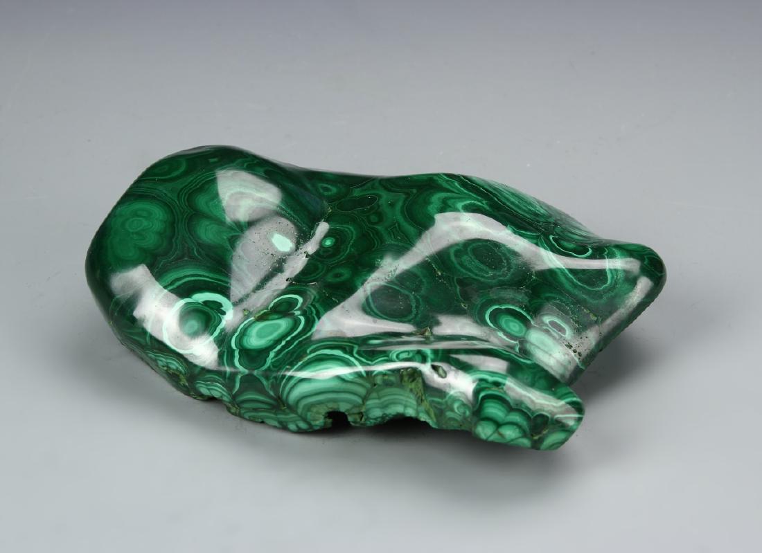 Chinese Malachite Scholar Rock: China, 19th C., malachite scholar rock, organically formed, with a polished, high shine surface and naturalistic base. Length 7 in., Height 6 in.