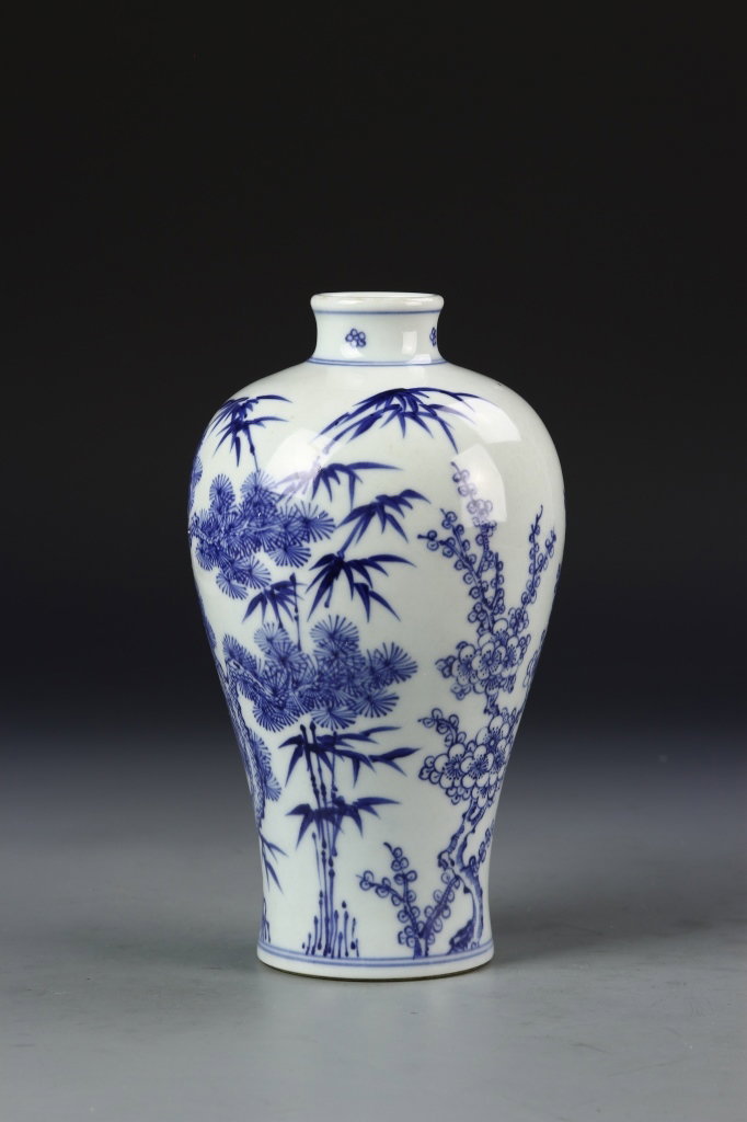 Chinese Meiping Vase: China, Qing dynasty, blue and white Meiping vase, small mouth, wide shoulders, tapering sides to flat base decorated with flowering trees and bamboo branches. Height 9 in.